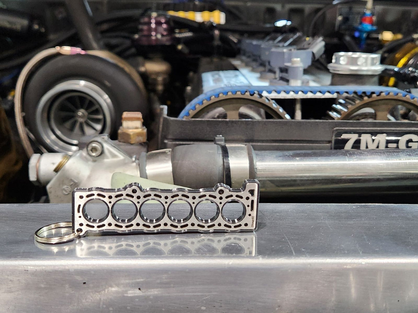 keychain - Schlüsselanhänger - Miniatur einer Kopfdichtung für Toyota 7M-GE/GTE - DisagrEE Germany