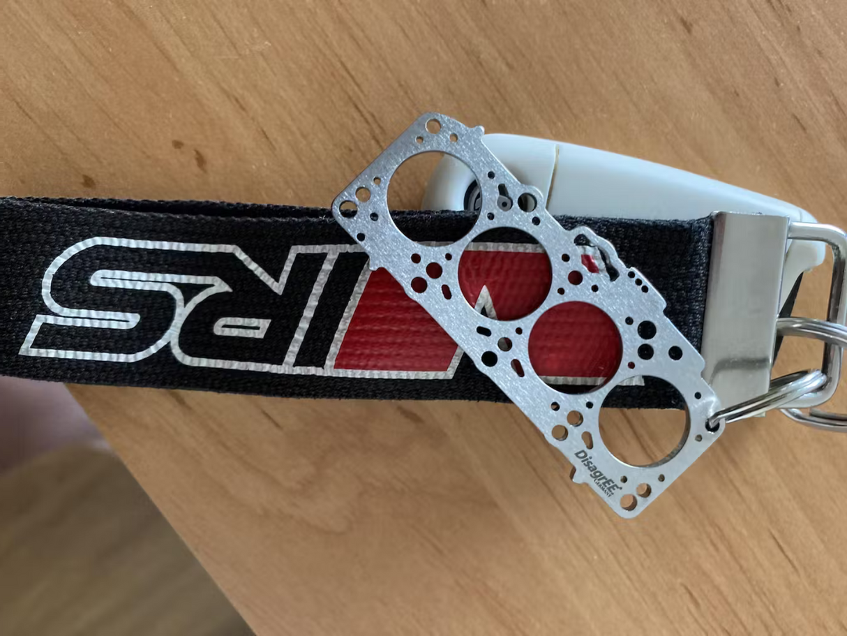 Miniatur einer Kopfdichtung für VAG 1,9 / 2,0 TDI EA188 - DisagrEE - keychain - Schlüsselanhänger