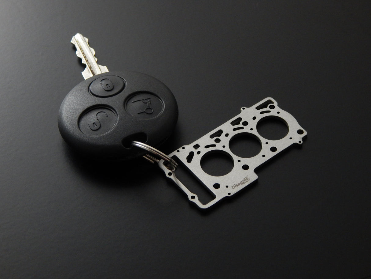 Miniatur einer Kopfdichtung für MB OM660 (Smart cdi) - DisagrEE - keychain - Schlüsselanhänger