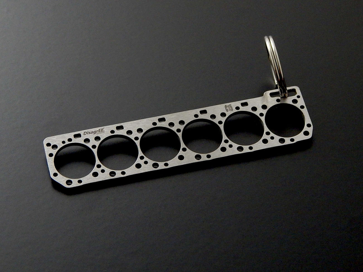 Miniatur einer Kopfdichtung für Caterpillar C15 - DisagrEE - keychain - Schlüsselanhänger