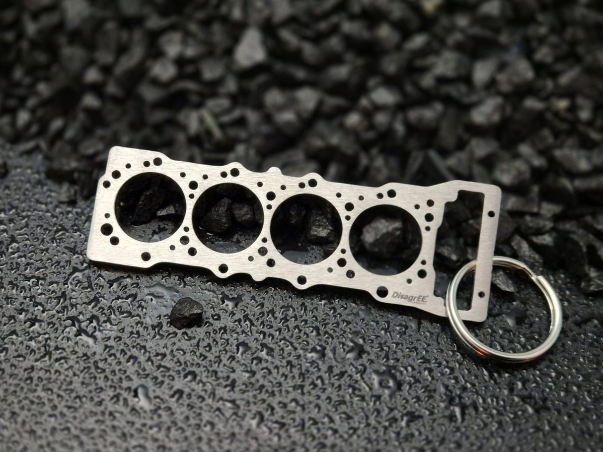 keychain - Schlüsselanhänger - Miniatur einer Kopfdichtung für Mitsubishi 4M41 / 4M42 - DisagrEE Germany