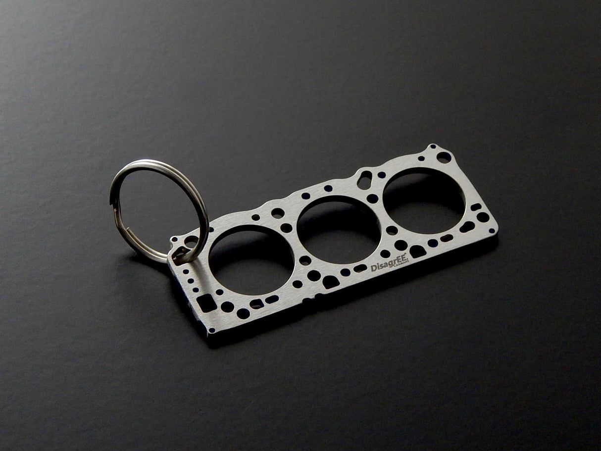 Miniatur einer Kopfdichtung für Mitsubishi 6G72 - DisagrEE - keychain - Schlüsselanhänger