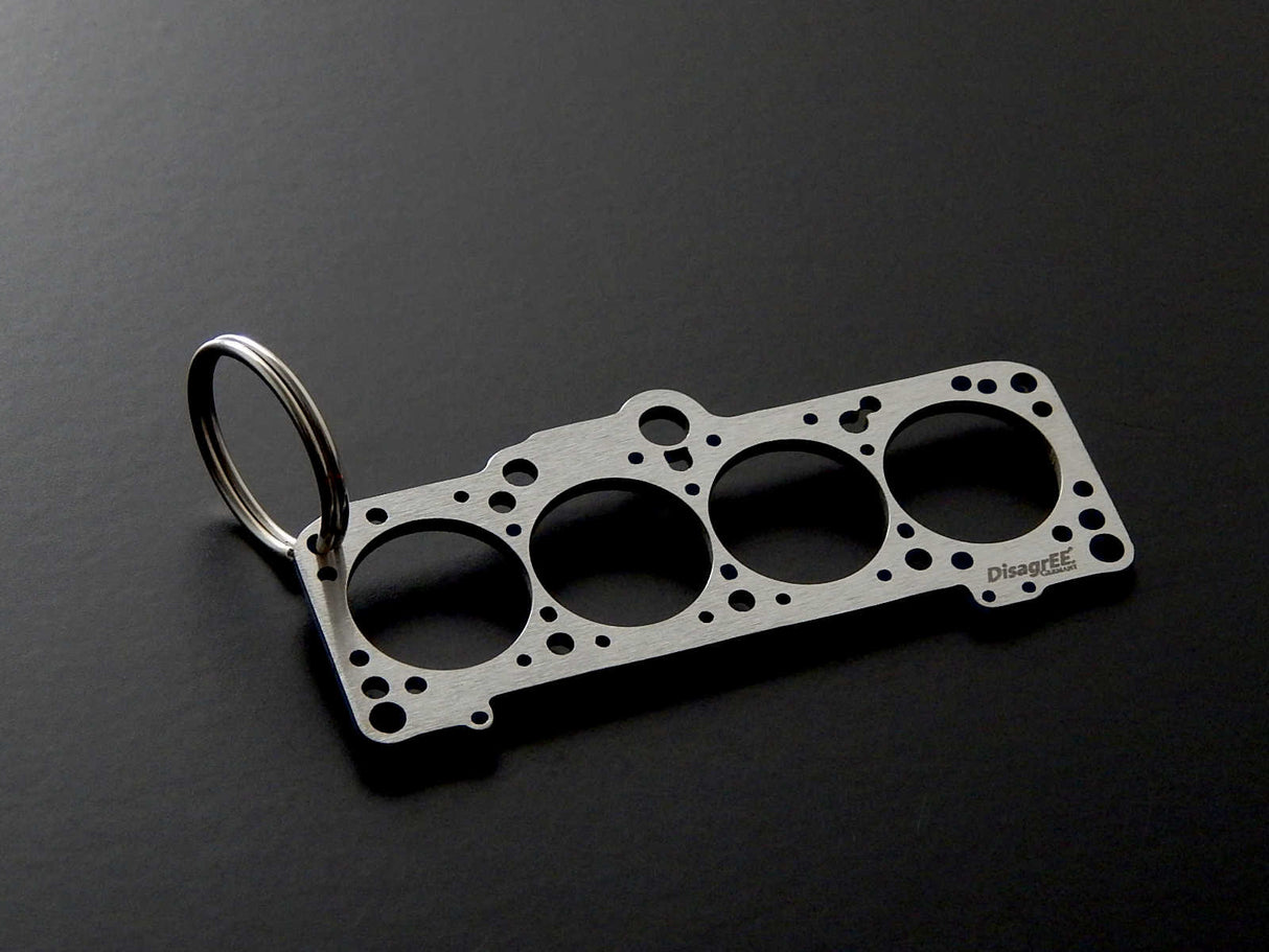 Miniatur einer Kopfdichtung für VAG 1,8-2,0 (EA827) - DisagrEE - keychain - Schlüsselanhänger