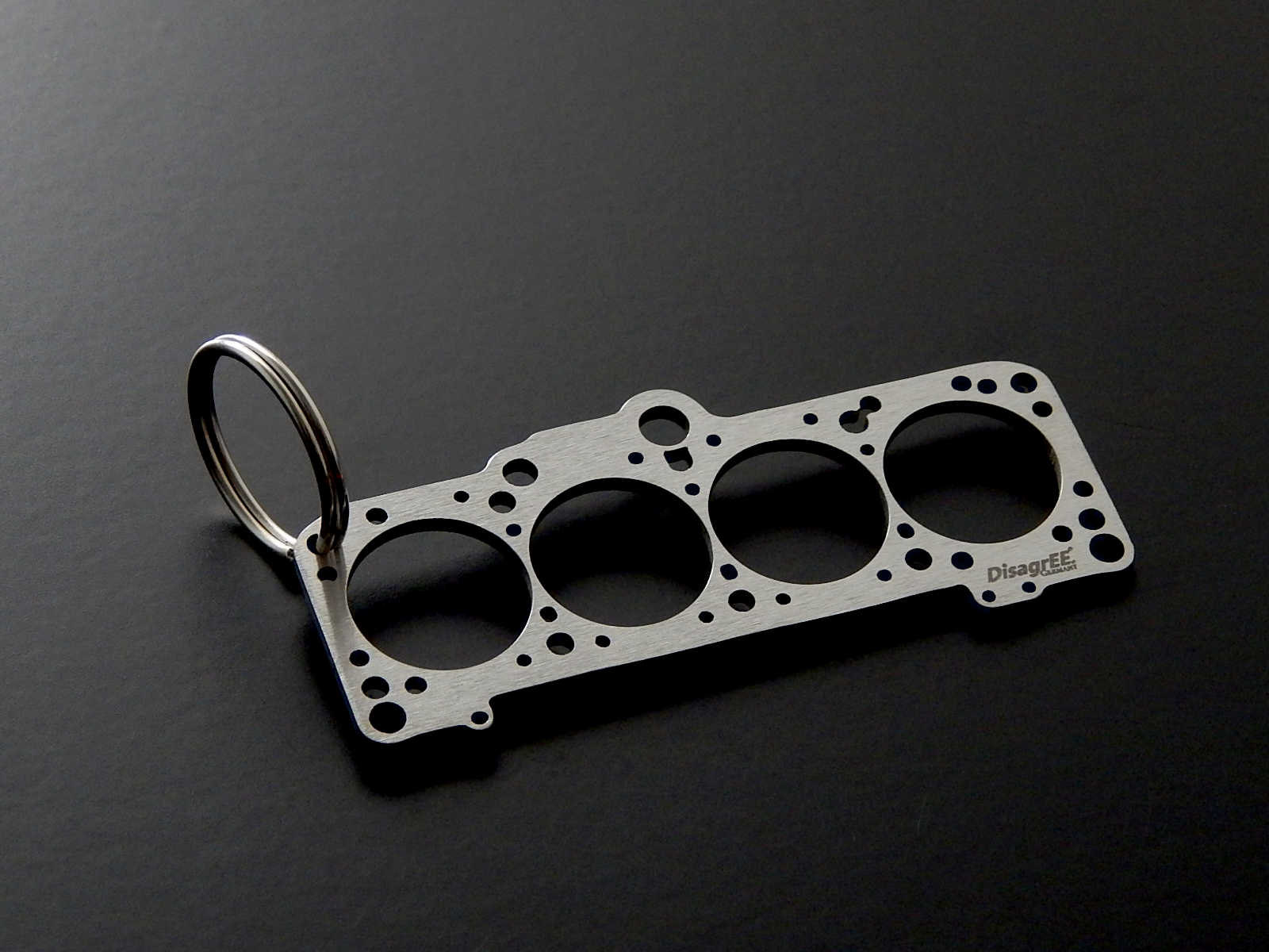 Miniatur einer Kopfdichtung für VAG 1,8-2,0 (EA827) - DisagrEE - keychain - Schlüsselanhänger