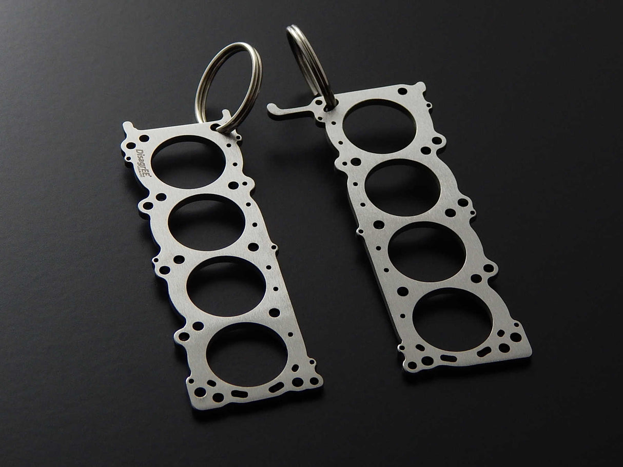 Miniatur einer Kopfdichtung für Nissan VK56DE - DisagrEE - keychain - Schlüsselanhänger