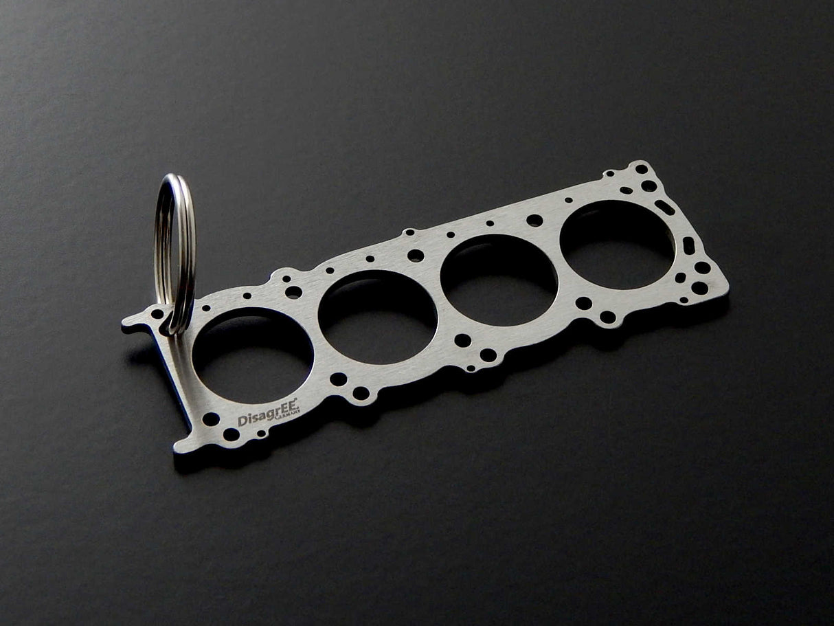 Miniatur einer Kopfdichtung für Nissan VK56DE - DisagrEE - keychain - Schlüsselanhänger