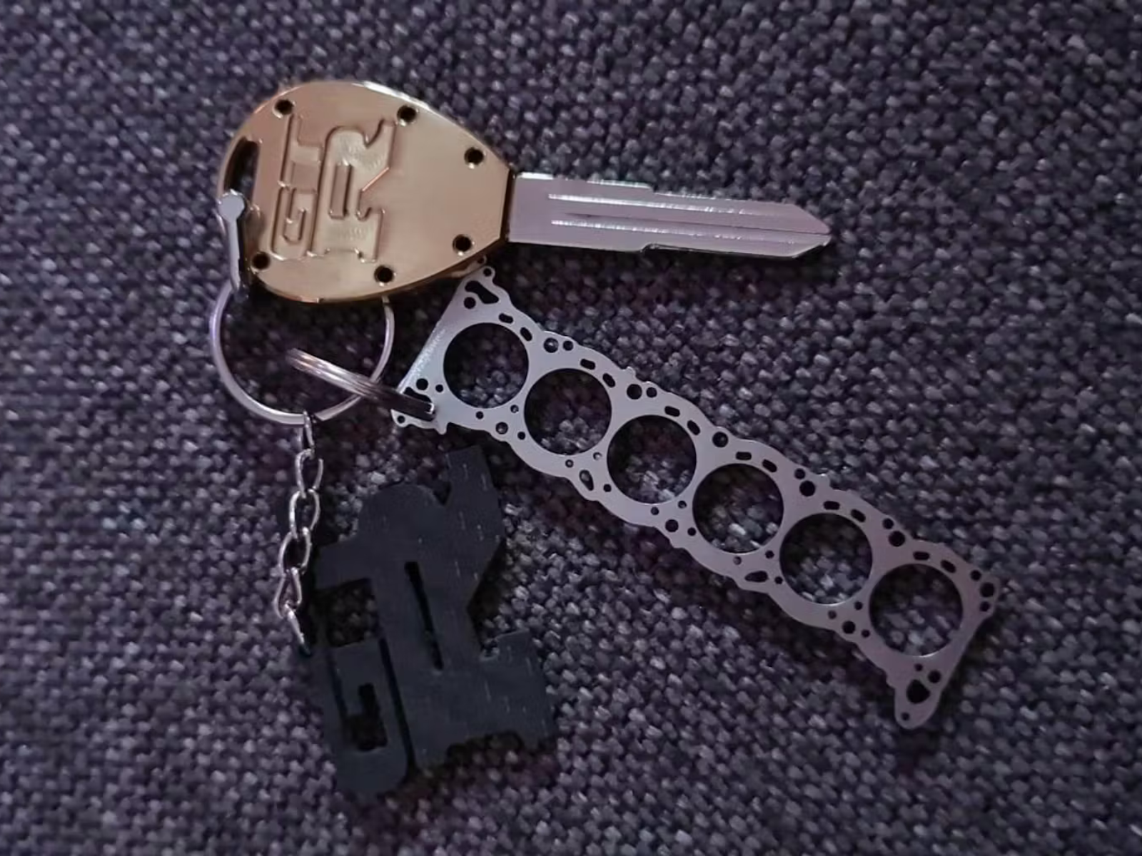 Miniatur einer Kopfdichtung für Nissan RB 20 / 25 / 26 / 30 - DisagrEE - keychain - Schlüsselanhänger