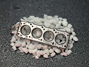 keychain - Schlüsselanhänger - Miniatur einer Kopfdichtung für Volvo Redblock - DisagrEE Germany
