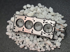 keychain - Schlüsselanhänger - Miniatur einer Kopfdichtung für BMW M42 / M44 - DisagrEE Germany