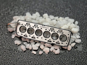 keychain - Schlüsselanhänger - Miniatur einer Kopfdichtung für Volvo B6 (2007-) (SI6) - DisagrEE Germany
