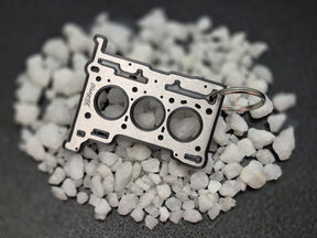 keychain - Schlüsselanhänger - Miniatur einer Kopfdichtung für Ford Ecoboost 1,0 "Fox" - DisagrEE Germany