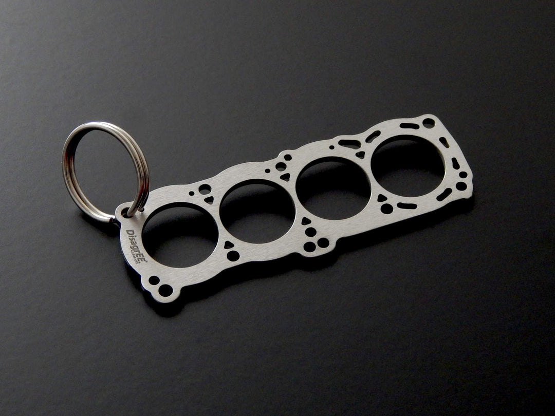 Miniatur einer Kopfdichtung für Nissan CA 16/18 - DisagrEE - keychain - Schlüsselanhänger