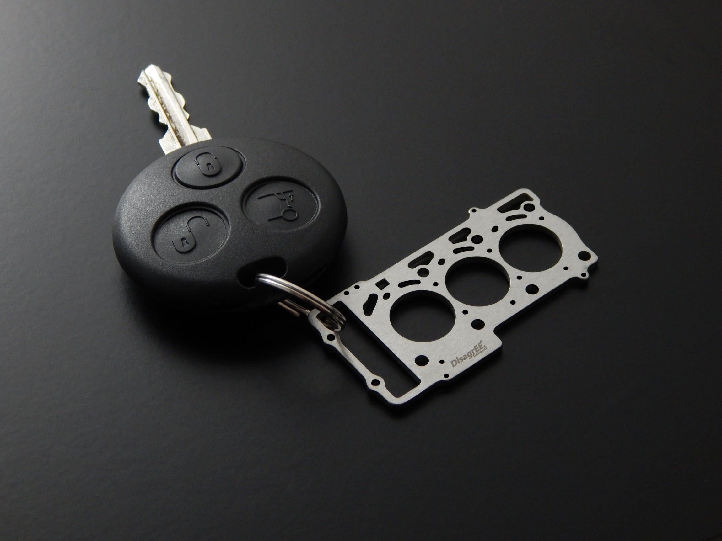 Miniatur einer Kopfdichtung für MB OM660 (Smart cdi) - DisagrEE - keychain - Schlüsselanhänger