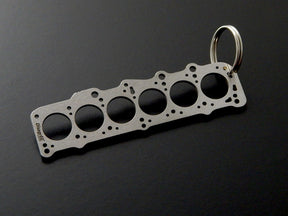 keychain - Schlüsselanhänger - Miniatur einer Kopfdichtung für VW/Volvo D24 / D24T - DisagrEE Germany