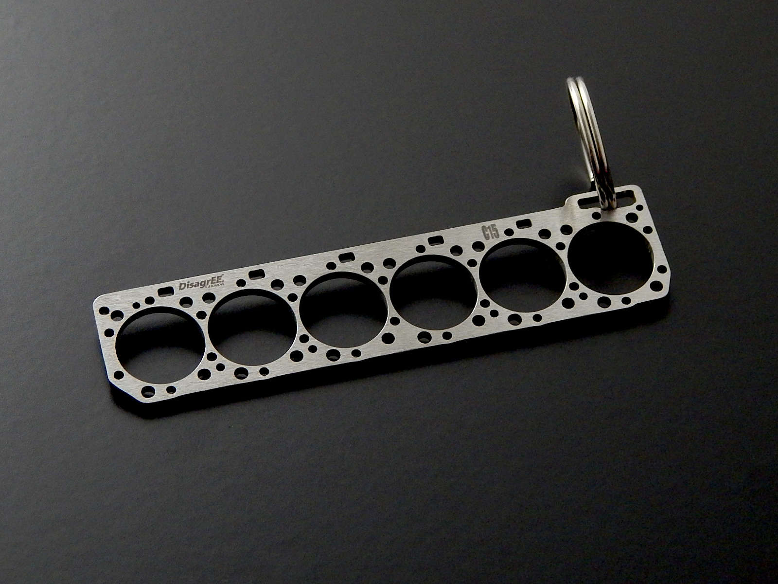 Miniature of a head gasket for Caterpillar C15 brushed stainless steel key  ring – DisagrEE