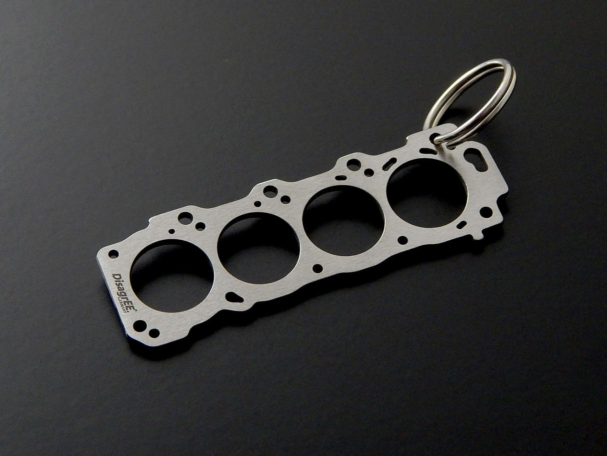 Miniatur einer Kopfdichtung für Toyota 2UZ-FE - DisagrEE - keychain - Schlüsselanhänger