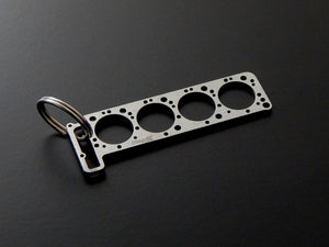 Miniatur einer Kopfdichtung für Mercedes M116 / M117 - DisagrEE - keychain - Schlüsselanhänger
