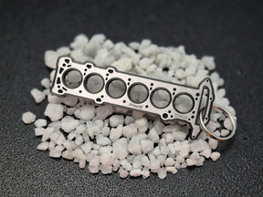 keychain - Schlüsselanhänger - Miniatur einer Kopfdichtung für Nissan TB48 - DisagrEE Germany