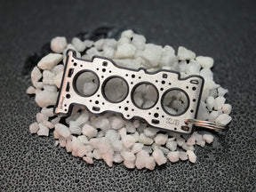 keychain - Schlüsselanhänger - Miniatur einer Kopfdichtung für Mazda MZR 1.8 / 2.0 - DisagrEE Germany