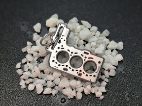 keychain - Schlüsselanhänger - Miniatur einer Kopfdichtung für BMW B38 - DisagrEE Germany