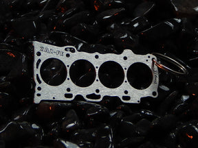keychain - Schlüsselanhänger - Miniatur einer Kopfdichtung für Toyota 2AZ-FE - DisagrEE Germany