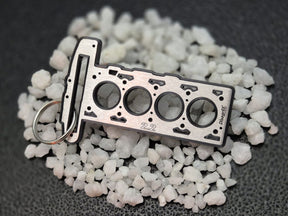 keychain - Schlüsselanhänger - Miniatur einer Kopfdichtung für Alfa Romeo 2.2 JTS - DisagrEE Germany