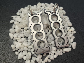 keychain - Schlüsselanhänger - Miniatur einer Kopfdichtung für Volvo B8444 V8 - DisagrEE Germany