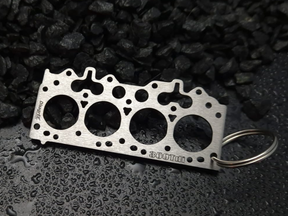 keychain - Schlüsselanhänger - Miniatur einer Kopfdichtung für Land Rover 300Tdi - DisagrEE Germany