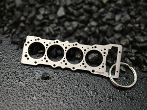 keychain - Schlüsselanhänger - Miniatur einer Kopfdichtung für Mitsubishi 4M41 / 4M42 - DisagrEE Germany