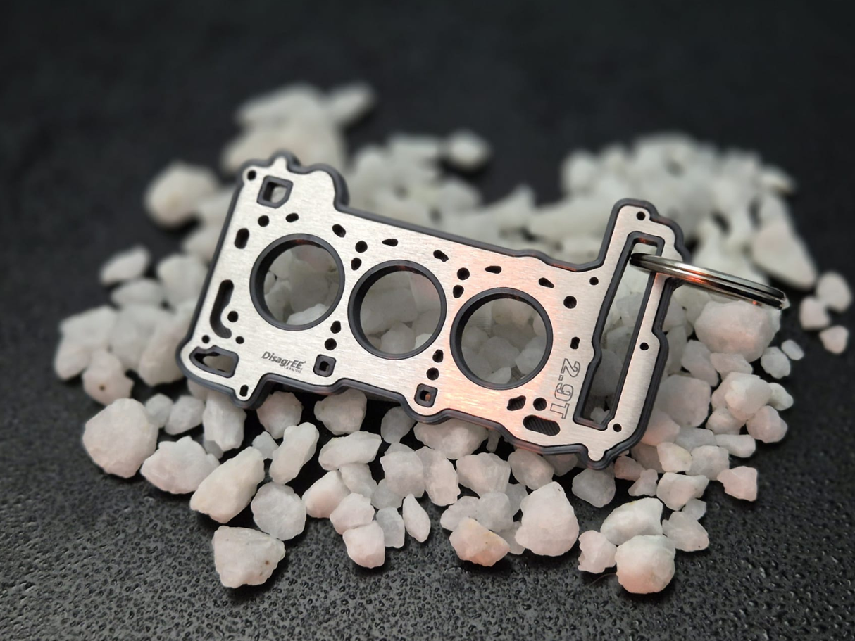 keychain - Schlüsselanhänger - Miniatur einer Kopfdichtung für Audi/Porsche 2.9 TFSI BiTurbo EA839 - DisagrEE Germany