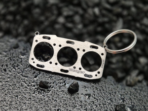 Miniatur einer Kopfdichtung für Porsche M96.7x/M97.7x - "Mezger Motor" DisagrEE