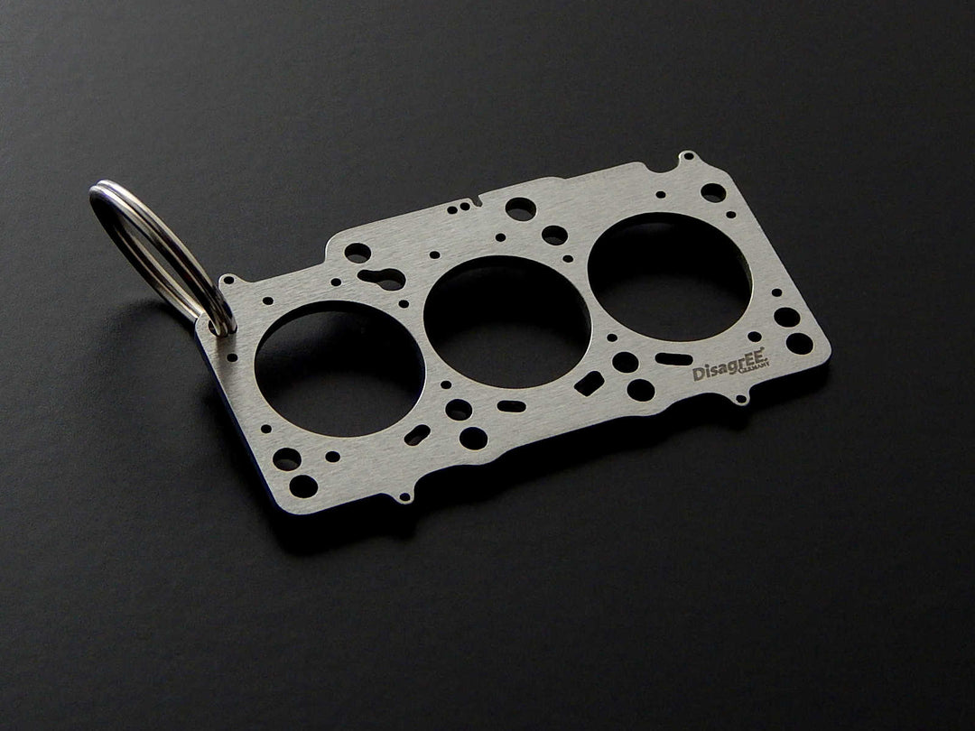 Miniatur einer Kopfdichtung für VAG 1,2 TDI (EA189) - DisagrEE - keychain - Schlüsselanhänger