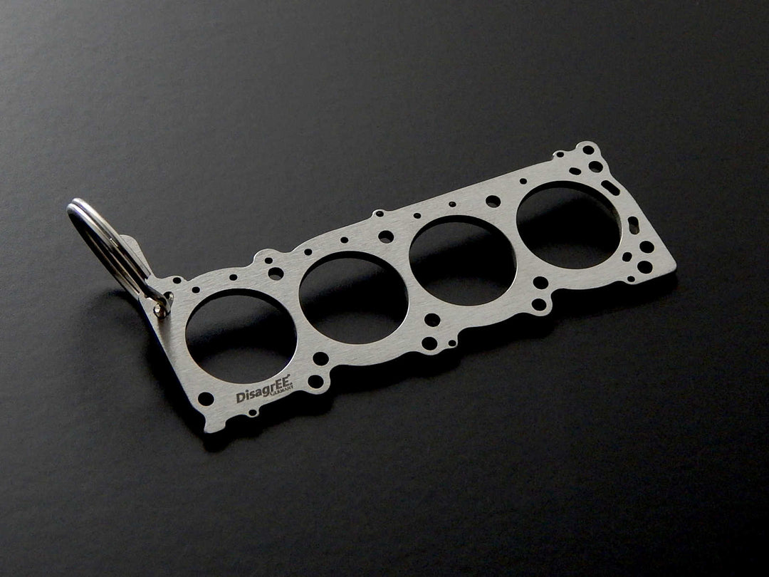 Miniatur einer Kopfdichtung für Nissan VK56DE - DisagrEE - keychain - Schlüsselanhänger